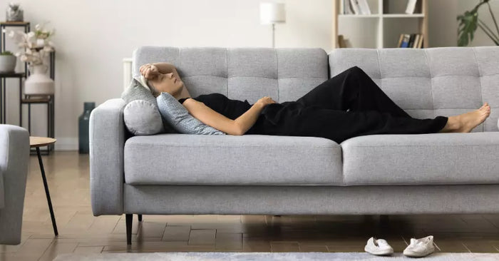 woman laying on couch